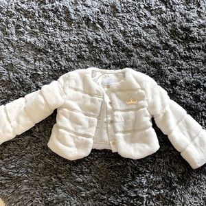 A fur white coat. A Disney princess Aurora coat.